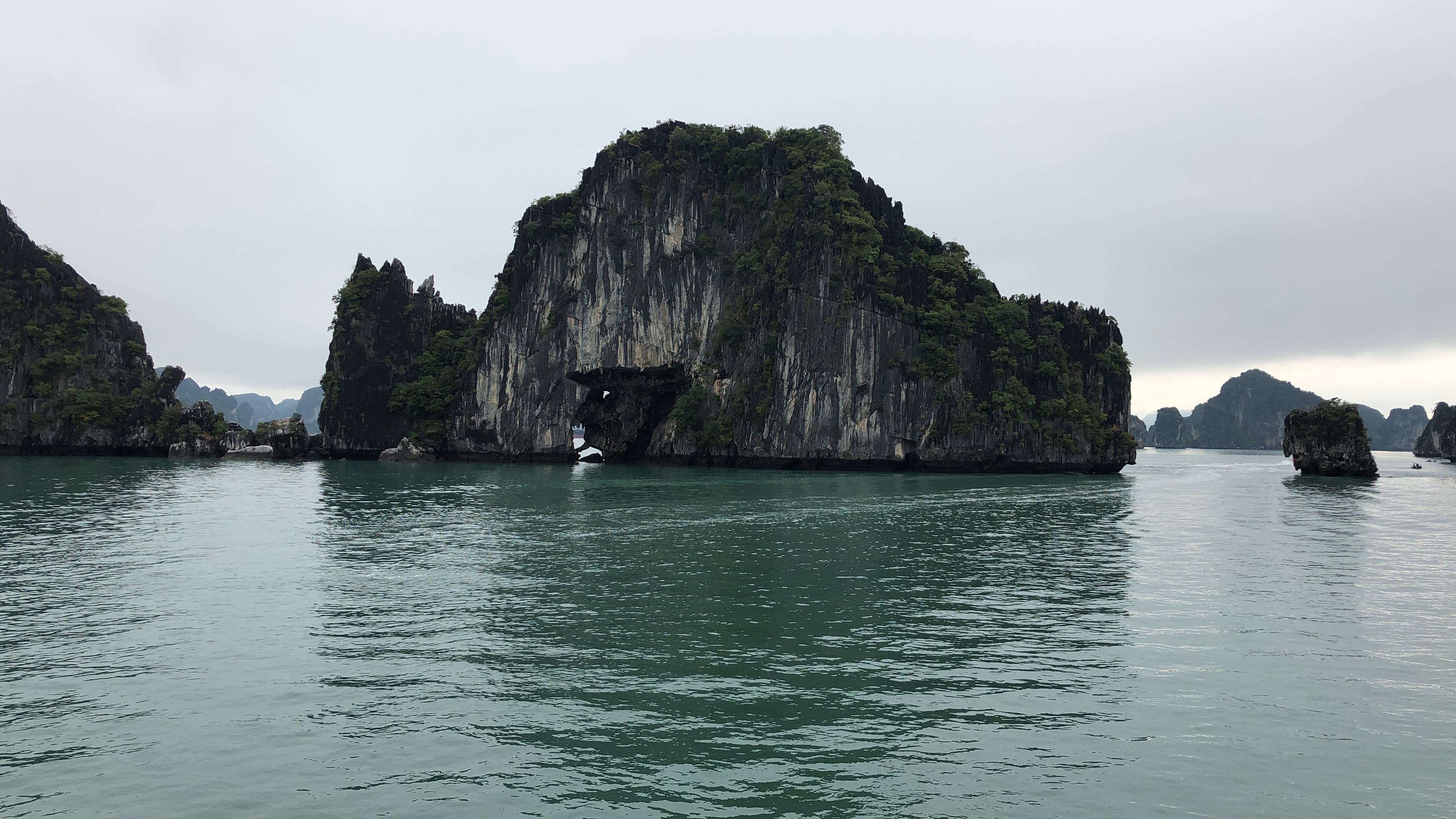 A stark rock formation in the ocean in Ha Long Bay, Vietnam.